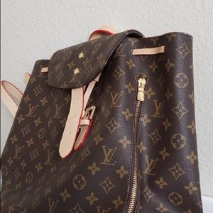 Large tan back pack with side pocket
